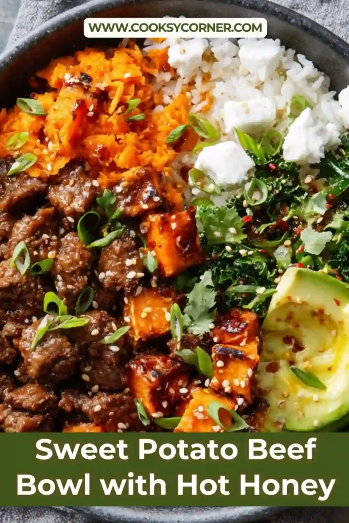 Close-up of a Sweet Potato Beef Bowl with Hot Honey featuring roasted sweet potatoes, lean ground beef, cheddar cheese, avocado, and black beans. The bowl is finished with cracked black pepper and spicy honey drizzle.