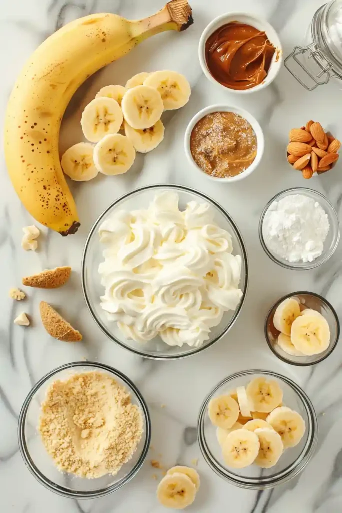 Elegant mini cheesecake cups filled with banana cheesecake and topped with whipped cream and almond butter. These easy no-bake desserts are perfect for parties and celebrations.