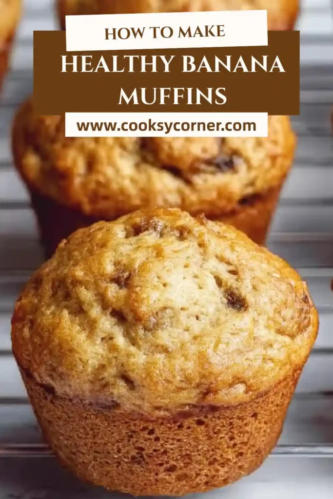 Freshly baked Greek Yogurt Banana Muffins cooling on a wire rack with melted chocolate chips and golden tops. These moist banana muffins are made with ripe bananas and whole wheat flour.