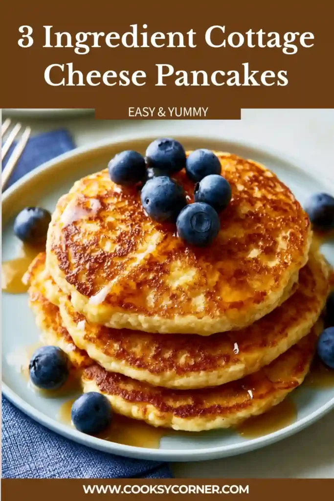 Golden cottage cheese pancakes served on a plate with fresh fruit.