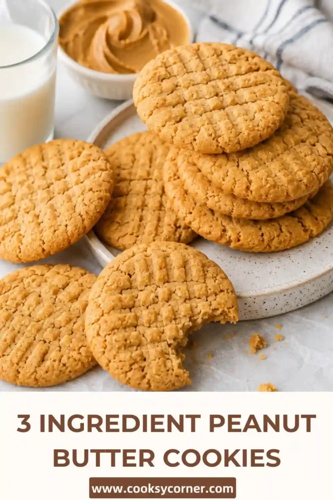 Close-up view of flourless peanut butter cookies stacked on a serving plate. Each cookie has a traditional fork-pressed pattern and golden finish.