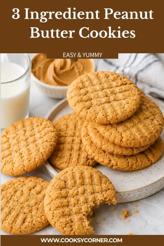Freshly baked 3 Ingredient Peanut Butter Cookies cooling on a wire rack. These easy flourless peanut butter cookies have a classic fork pattern and golden edges.