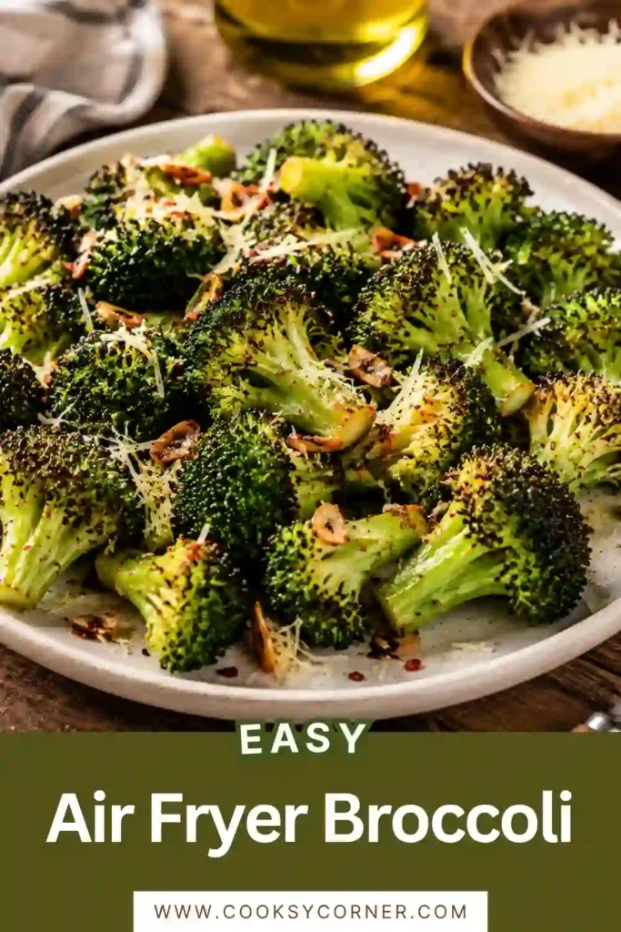 Golden Air Fryer Broccoli florets topped with Parmesan cheese and herbs. A quick and healthy vegetable side dish cooked perfectly in the air fryer.