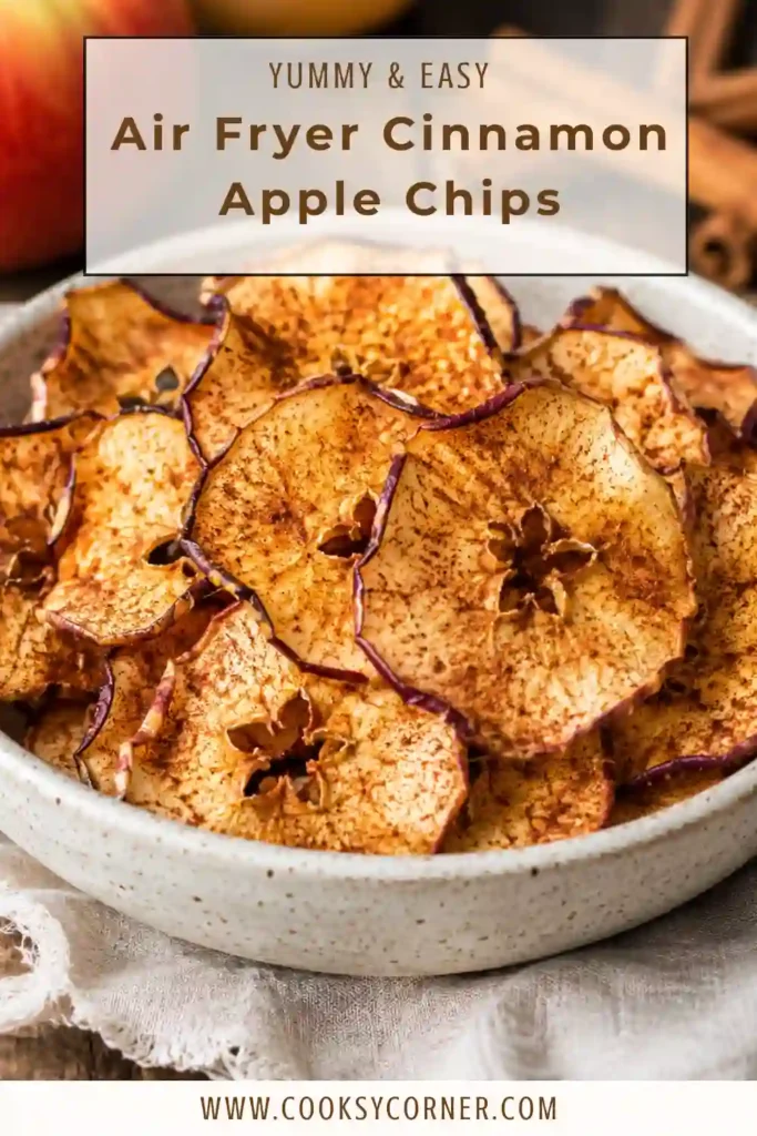 Thin apple slices air fried until crispy and golden brown, served in a rustic bowl.