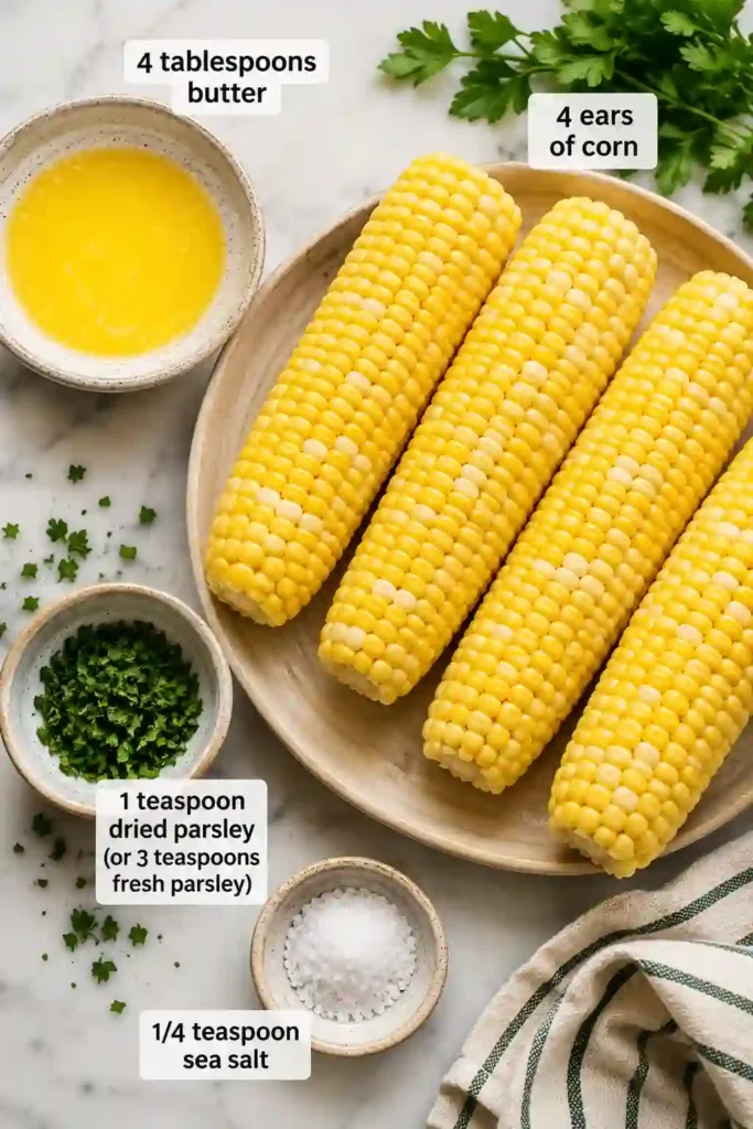 Perfectly roasted Air Fryer Corn on the Cob seasoned with butter, parsley, and sea salt. A simple and delicious summer recipe with sweet, tender kernels.