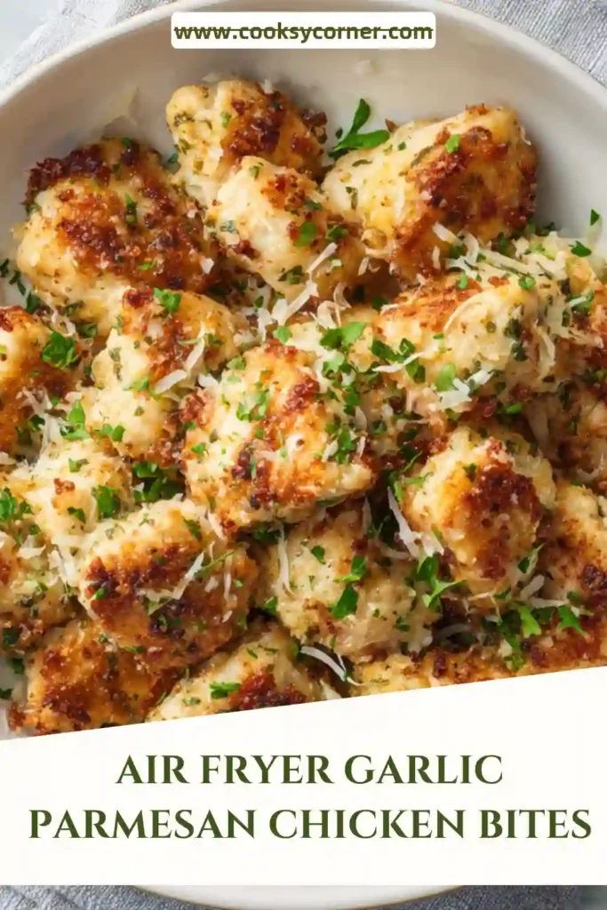 Air Fryer Garlic Parmesan Chicken Bites served in a white bowl with Parmesan cheese, parsley, and dipping sauce. The chicken is crispy, juicy, and packed with savory garlic flavor.