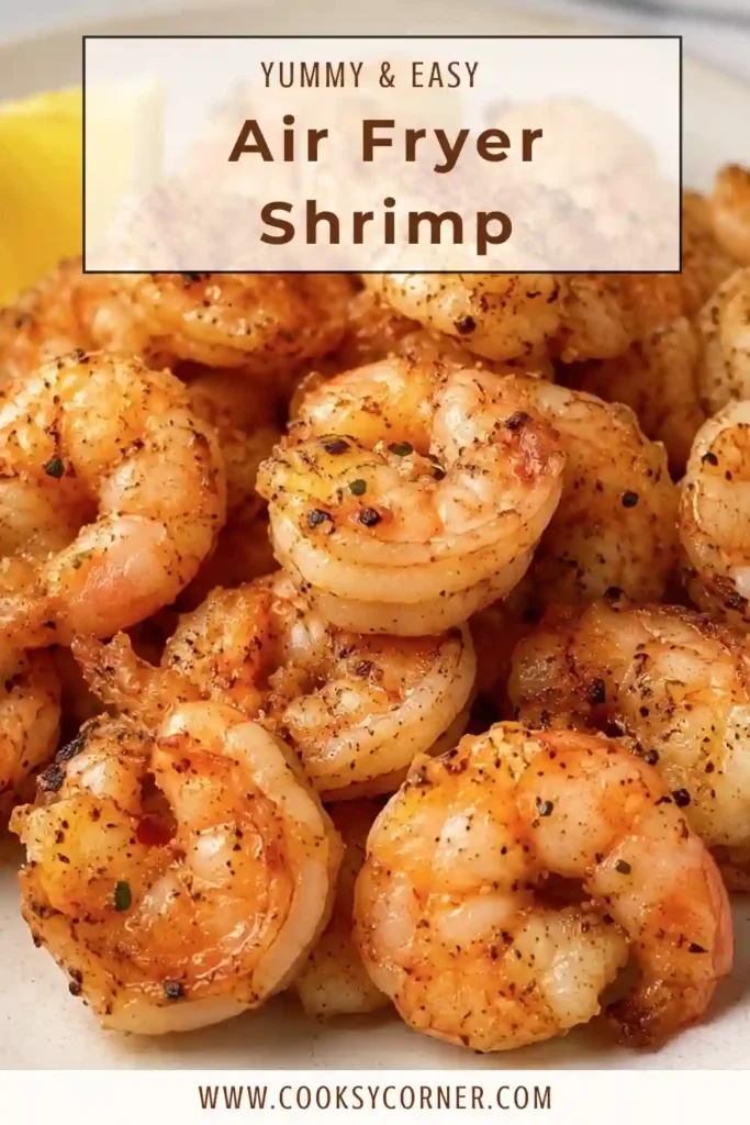 Freshly cooked Air Fryer Shrimp with olive oil, lemon juice, salt, and black pepper. A quick and healthy seafood recipe perfect for busy weeknights.