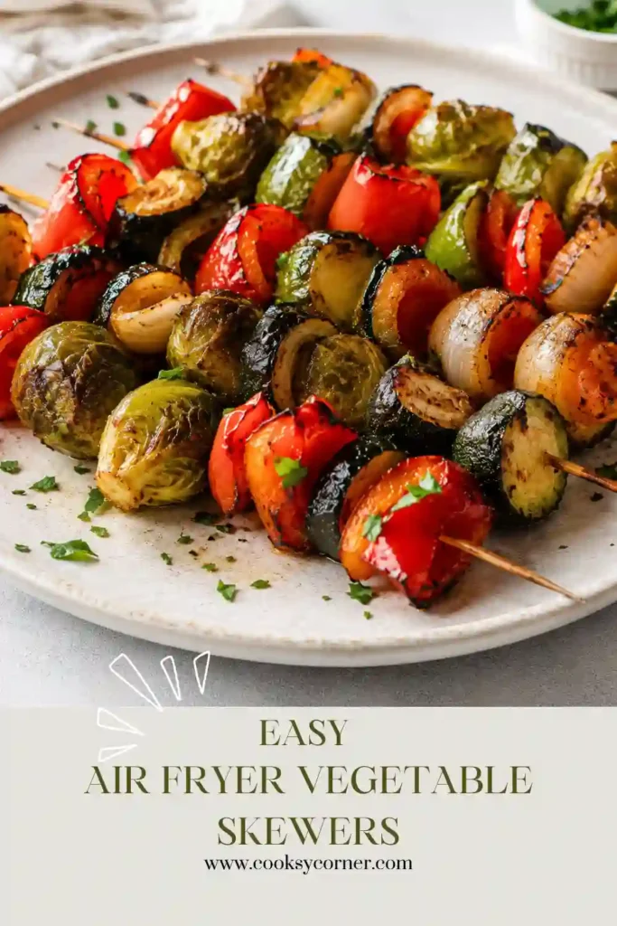 Colorful vegetable skewers cooked in an air fryer and served fresh. The skewers feature crispy Brussels sprouts, tender zucchini, and vibrant bell peppers.