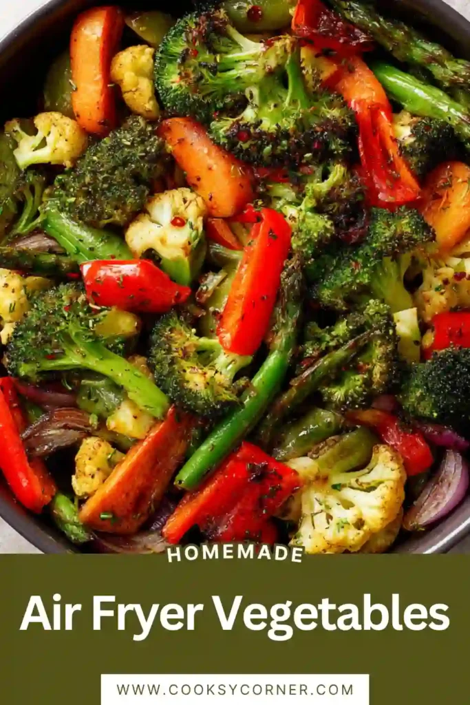 Healthy Air Fryer Vegetables arranged in a serving bowl with broccoli, cauliflower, peppers, mushrooms, and zucchini. The vegetables appear crisp-tender and beautifully seasoned.