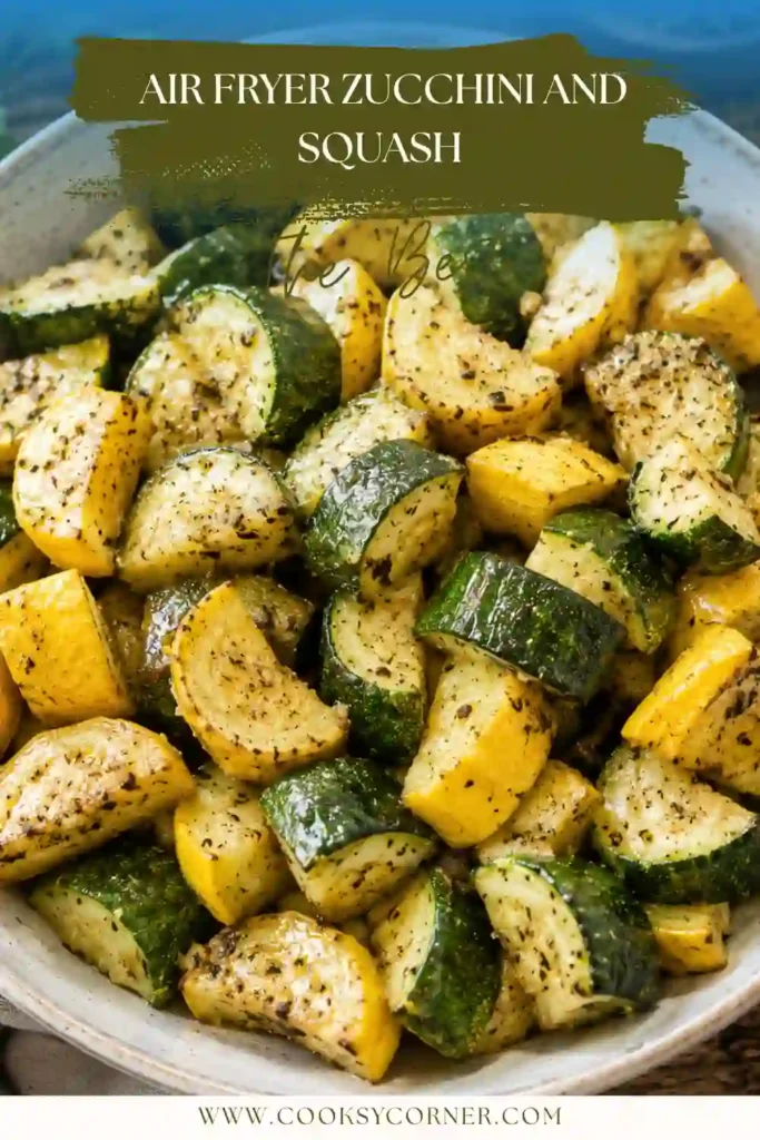 Fresh Air Fryer Zucchini and Squash served in a white bowl with lightly browned edges and Italian herbs. This healthy air fryer vegetable recipe makes an easy side dish for any meal.