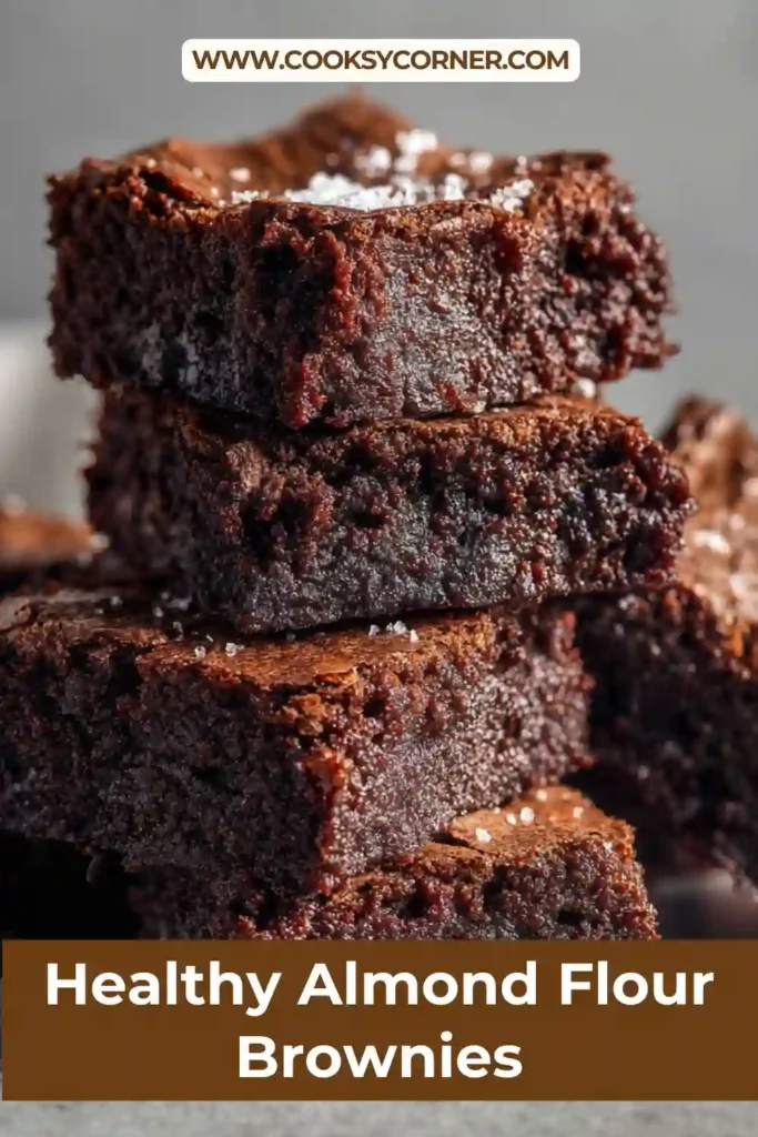 Fudgy Almond Flour Brownies cut into squares and topped with mini chocolate chips. A rich gluten-free dessert made with almond flour and cocoa powder.`