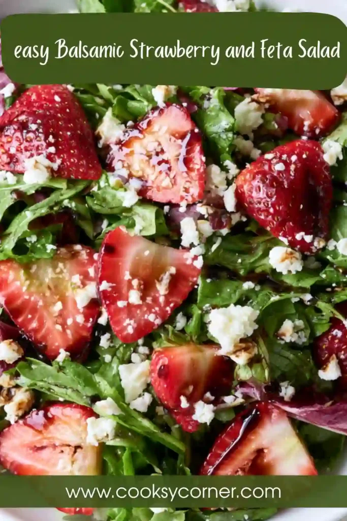 A colorful Balsamic Strawberry and Feta Salad featuring fresh strawberries, spinach, avocado, cucumbers, red cabbage, and crumbled feta cheese. The salad is lightly dressed with balsamic vinegar and olive oil.