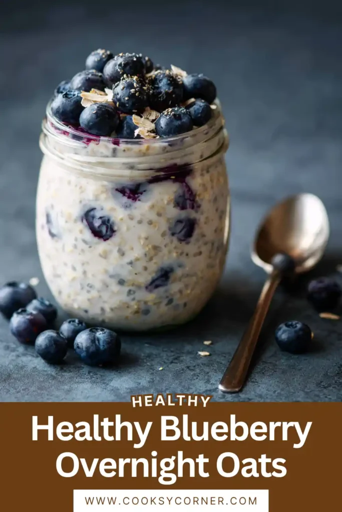 Blueberry Overnight Oats served in a glass jar topped with fresh blueberries and chia seeds.