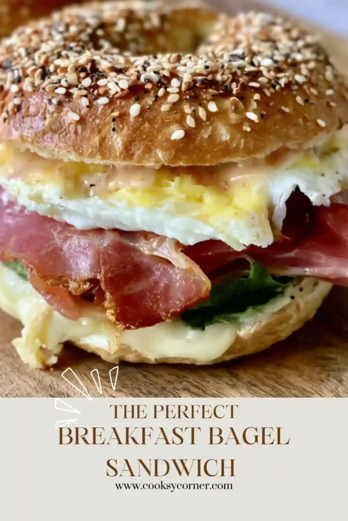 Close-up view of a Breakfast Bagel Sandwich featuring cheesy eggs and crispy mortadella layered inside a toasted bagel.