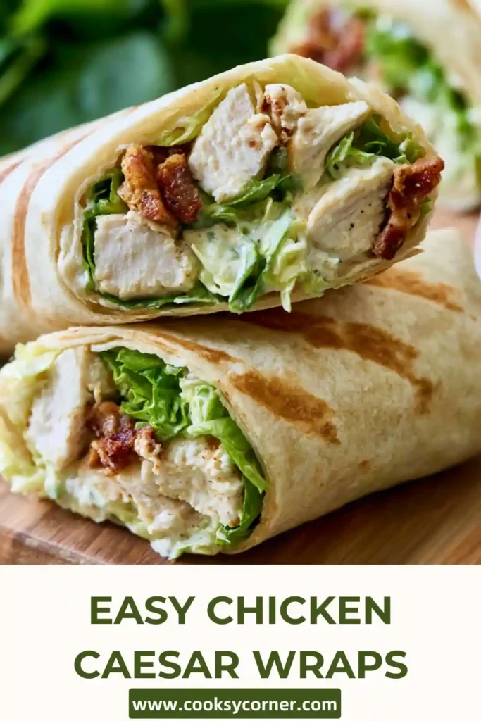 Fresh Chicken Caesar Wraps sliced in half and filled with shredded chicken, romaine lettuce, Parmesan cheese, and creamy Caesar dressing. A quick and easy lunch recipe served on a wooden board.