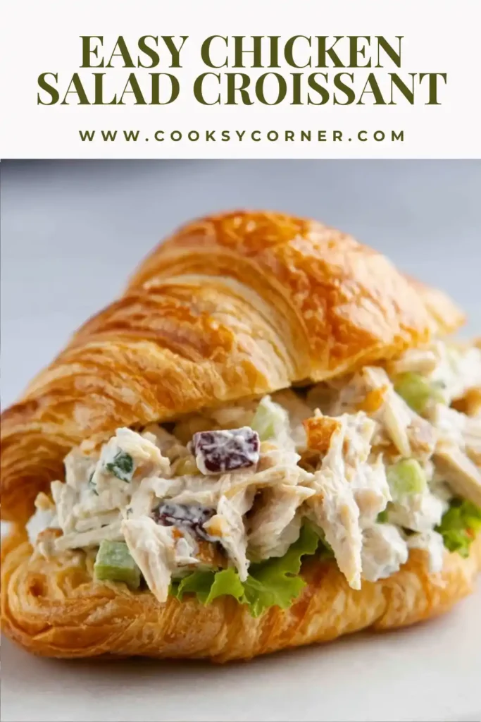 Fresh chicken salad croissant sandwich garnished with lettuce and tomatoes on a serving platter. A perfect lunch recipe made with simple ingredients.