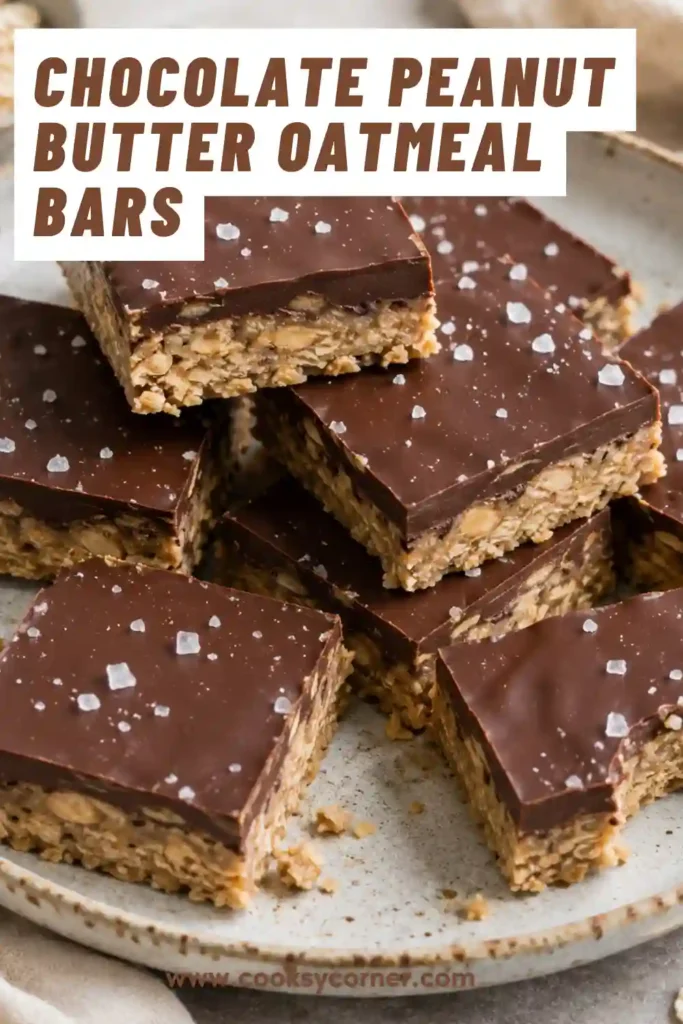 Homemade Chocolate Peanut Butter Oatmeal Bars sliced into squares and served on a ceramic plate. The bars feature layers of oats, peanut butter, and chocolate.