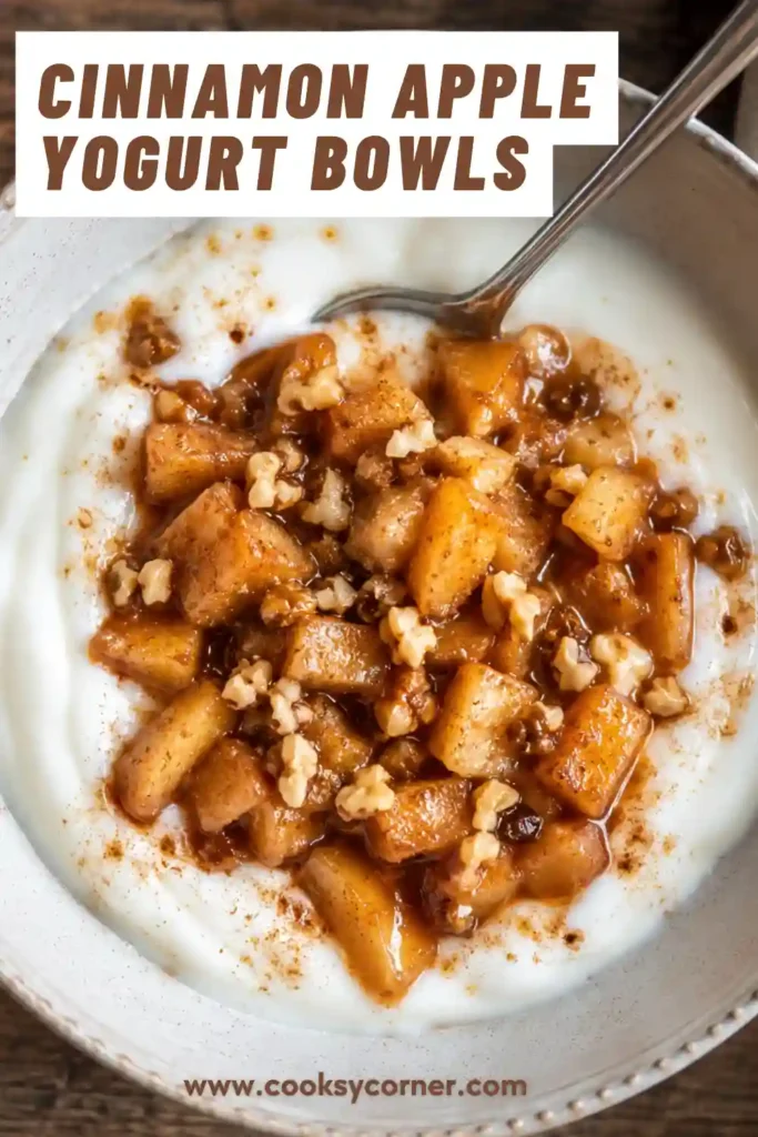 A bowl of creamy yogurt topped with warm cinnamon apples, raisins, and chopped walnuts. This healthy breakfast bowl is packed with flavor and nutrition.