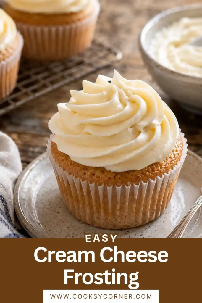 Silky Cream Cheese Frosting spread on a cake with smooth swirls and a creamy finish. A classic frosting for carrot cake and red velvet cake.