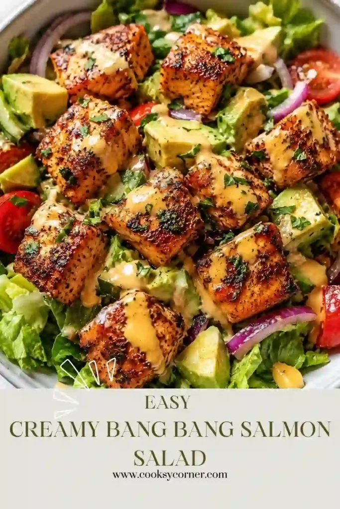 Creamy Bang Bang Salmon Salad featuring flaky salmon, fresh vegetables, cilantro, and homemade spicy dressing. A quick and nutritious meal for lunch or dinner.