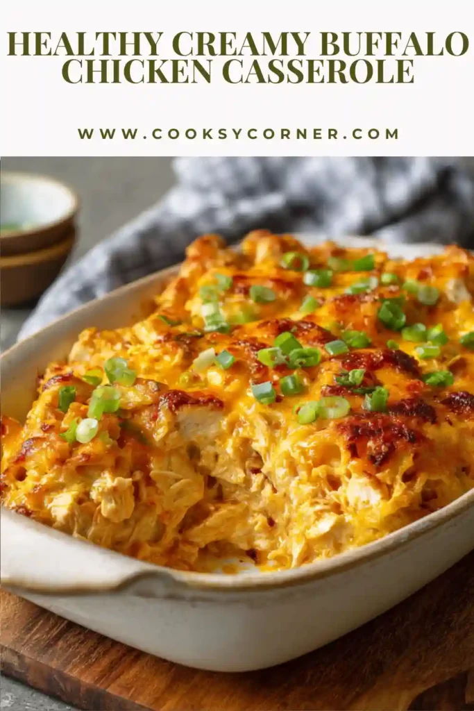 Creamy Buffalo Chicken Casserole topped with melted cheddar cheese and green onions.