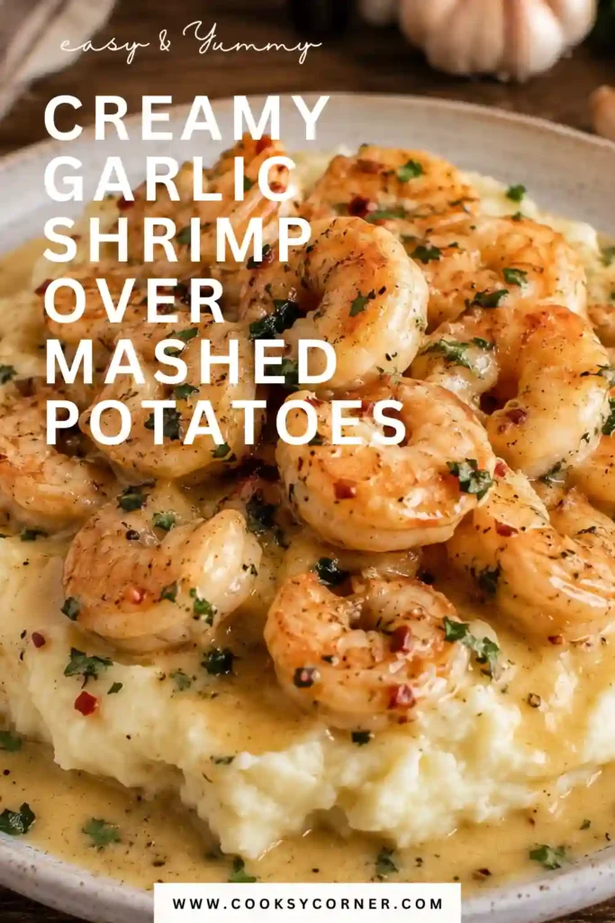 Close-up of garlic butter shrimp nestled on creamy mashed potatoes with rich Parmesan sauce. This easy shrimp dinner looks warm, comforting, and perfect for family meals.