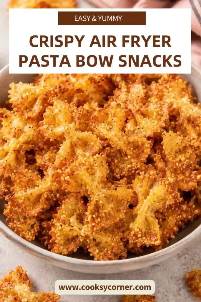 Golden brown farfalle pasta chips cooked in the air fryer until crunchy and garnished with fresh herbs.