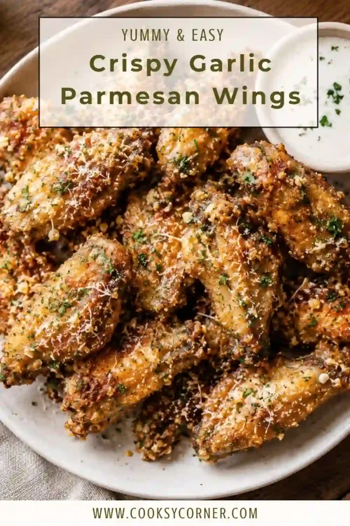 Crispy Garlic Parmesan Wings served on a platter with grated Parmesan cheese, chopped parsley, and garlic butter sauce.