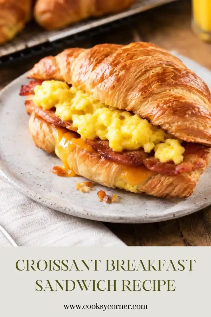 Golden croissant stuffed with scrambled eggs, turkey bacon, and sharp cheddar cheese. This homemade breakfast sandwich is perfect for busy mornings.