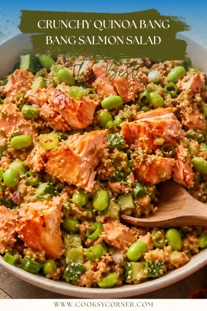 Crunchy Quinoa Bang Bang Salmon Salad served in a white bowl with avocado and edamame.