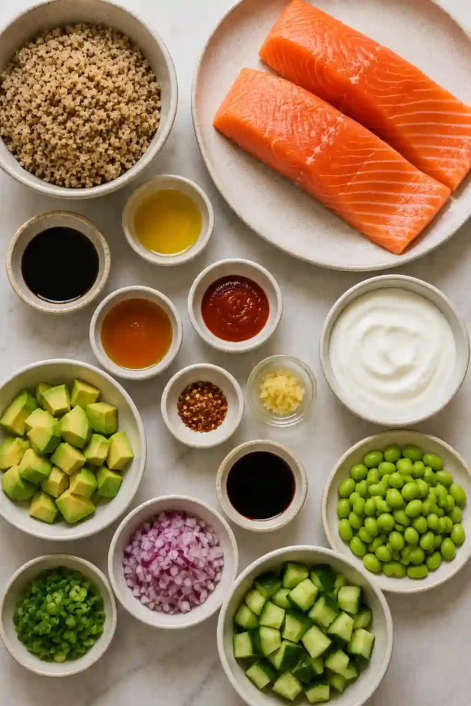 Close-up of Crunchy Quinoa Bang Bang Salmon Salad showing crispy quinoa, flaky salmon, cucumbers, and creamy dressing.