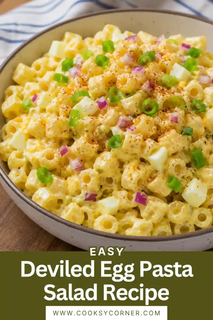 Freshly prepared Deviled Egg Pasta Salad served in a white bowl with green onion garnish. A perfect picnic pasta salad for warm-weather gatherings.