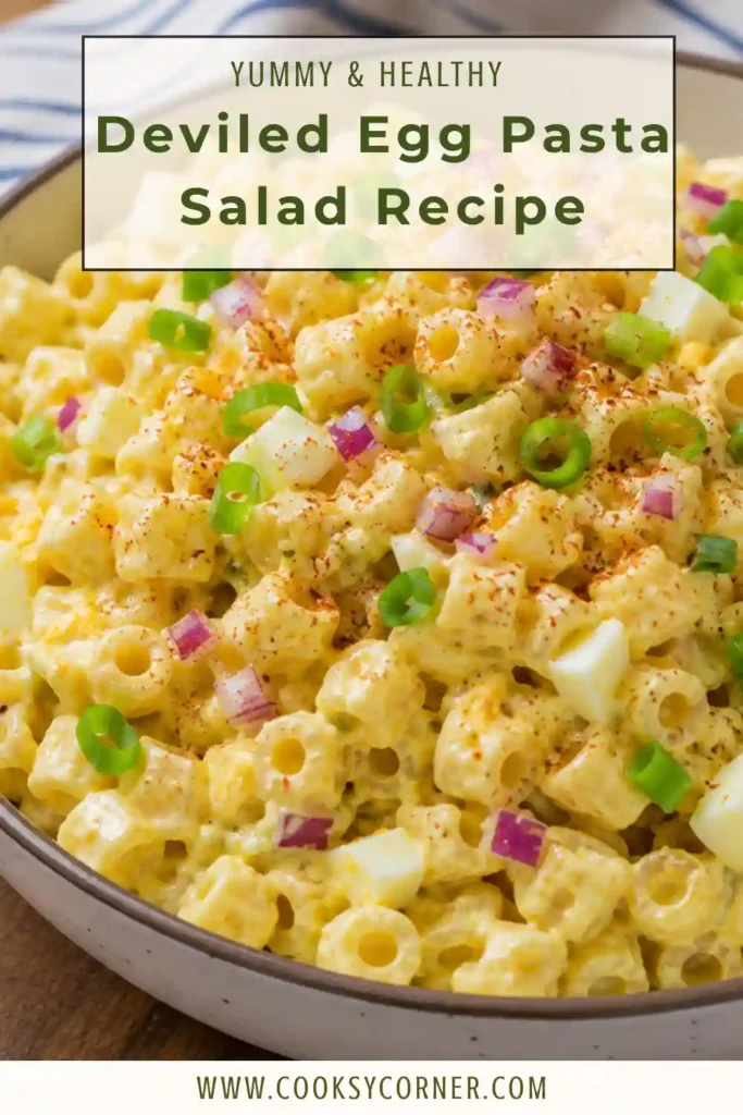 A bowl of creamy Deviled Egg Pasta Salad made with tender macaroni, chopped hard-boiled eggs, and a rich mustard dressing. Garnished with paprika and green onions for a classic presentation.