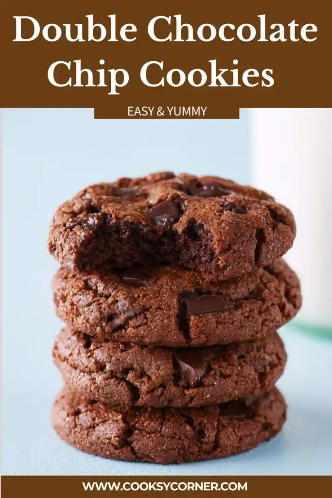Freshly baked Double Chocolate Chip Cookies cooling on a baking rack. The cookies have cracked tops, chewy centers, and melted chocolate chips throughout.