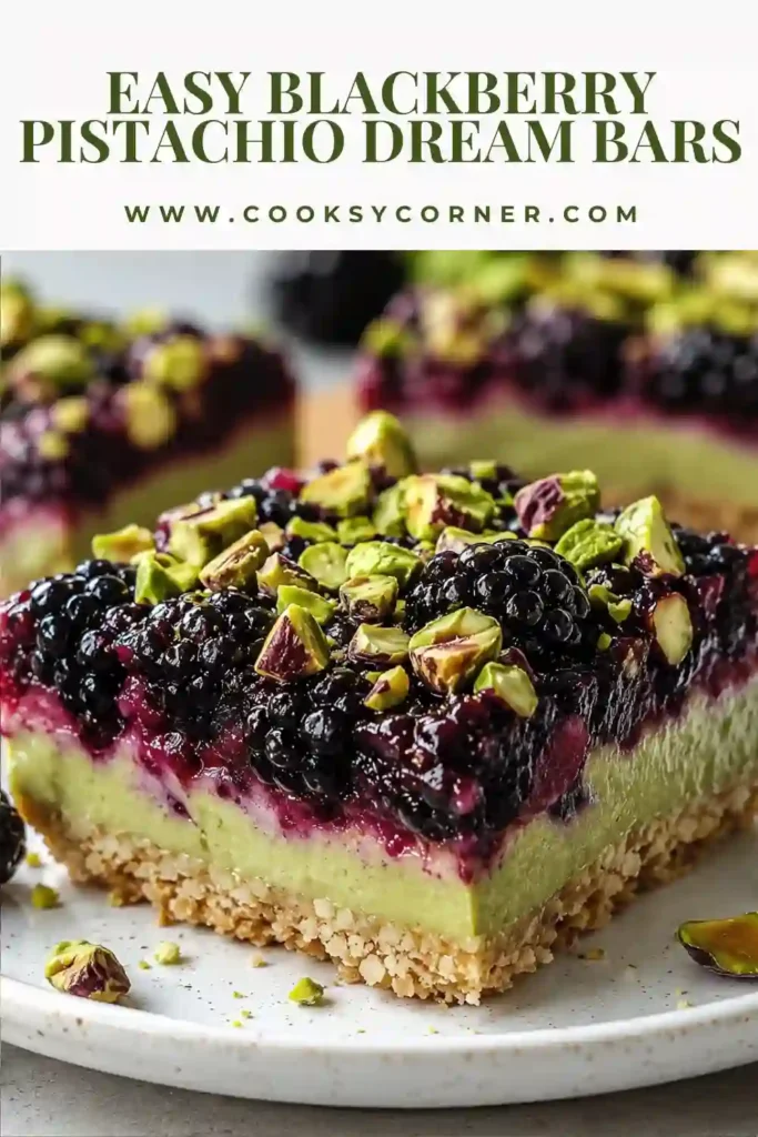 Homemade blackberry dessert bars topped with crunchy pistachios and filled with sweet blackberry jam.