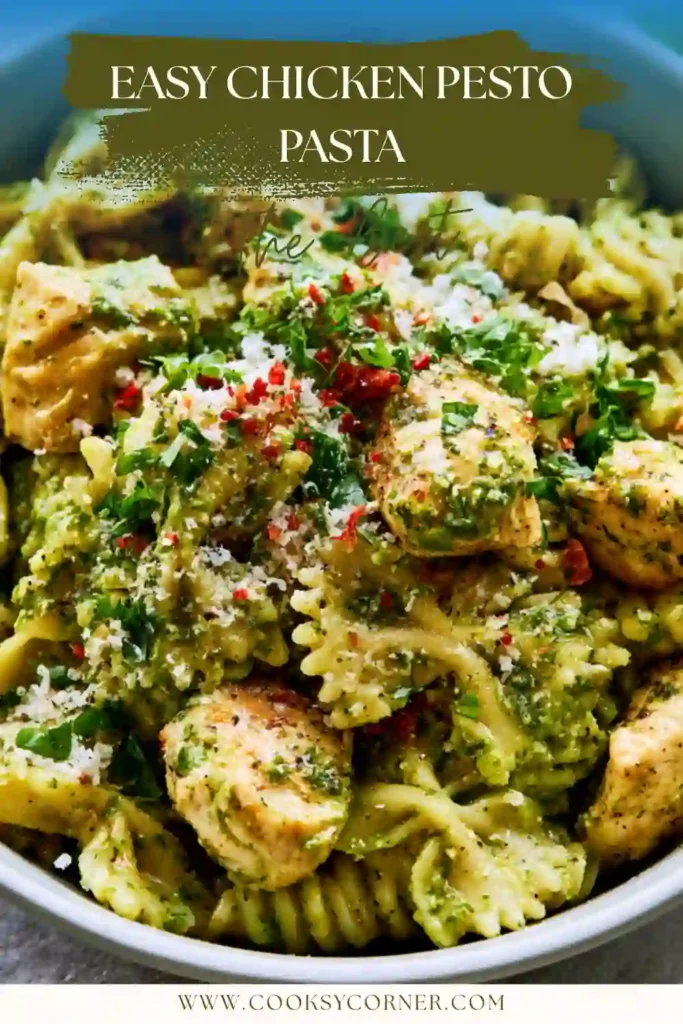 Bowl of farfalle pasta tossed with pesto sauce and chicken pieces.