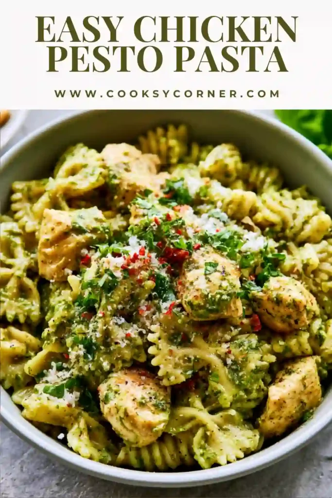 Chicken Pesto Pasta served in a bowl with basil pesto, cherry tomatoes, and Parmesan cheese.