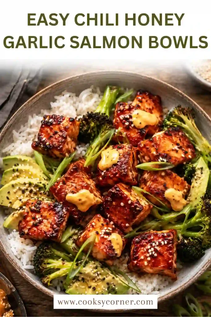 Chili honey garlic salmon bowls topped with avocado, sesame seeds, roasted broccoli, and spicy creamy sauce served in individual bowls.
