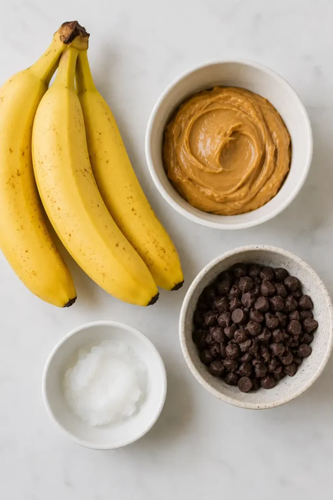 Chocolate Peanut Butter Banana Bites served chilled with a glossy chocolate coating and creamy peanut butter center.