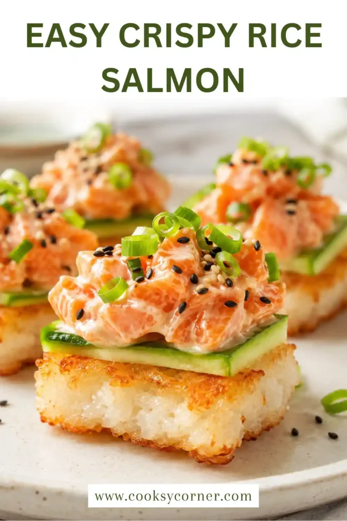 Golden crispy sushi rice topped with creamy salmon, cucumber slices, sesame seeds, and green onions on a serving platter.