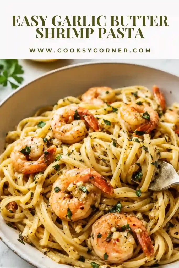 Garlic Butter Shrimp Pasta served in a bowl with fettuccine, Parmesan cheese, fresh parsley, and tender shrimp.
