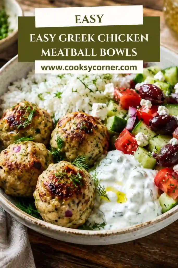 Healthy Greek chicken bowl featuring tender chicken meatballs, fresh vegetables, feta cheese, and herb yogurt dressing. Bright Mediterranean flavors fill every bite.