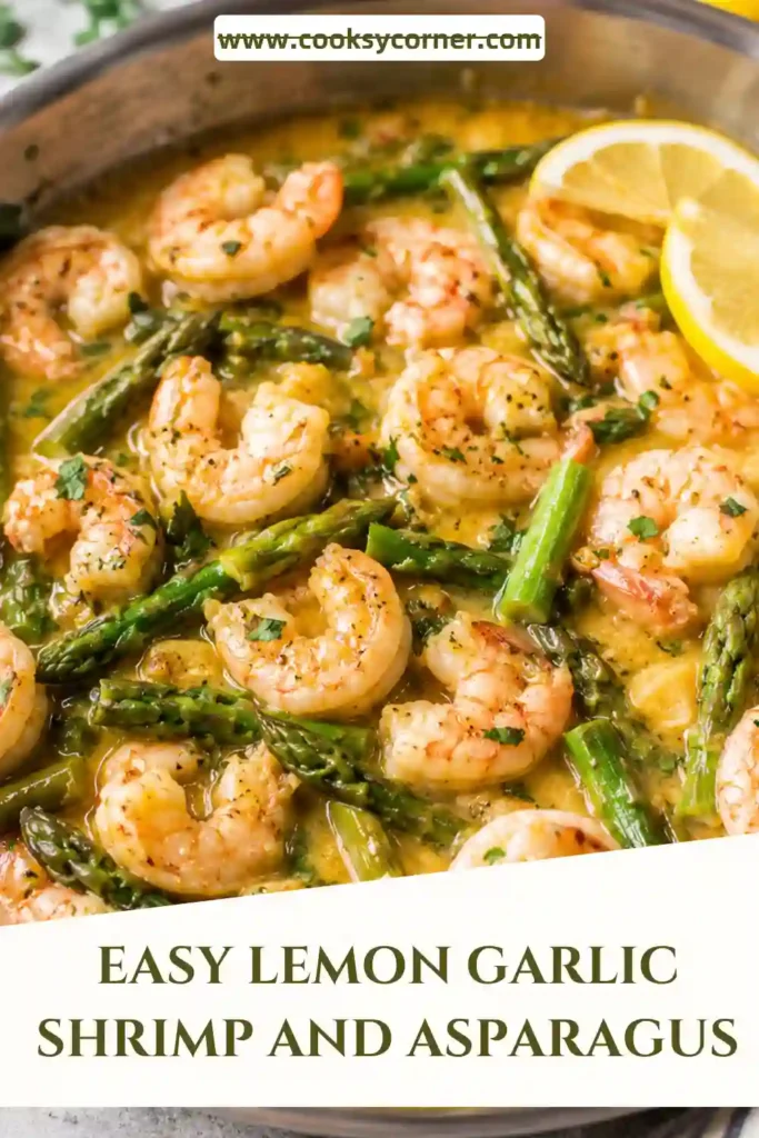 A skillet of lemon garlic shrimp and asparagus cooked in a buttery sauce and garnished with fresh basil. The shrimp are tender and juicy with bright citrus flavor.
