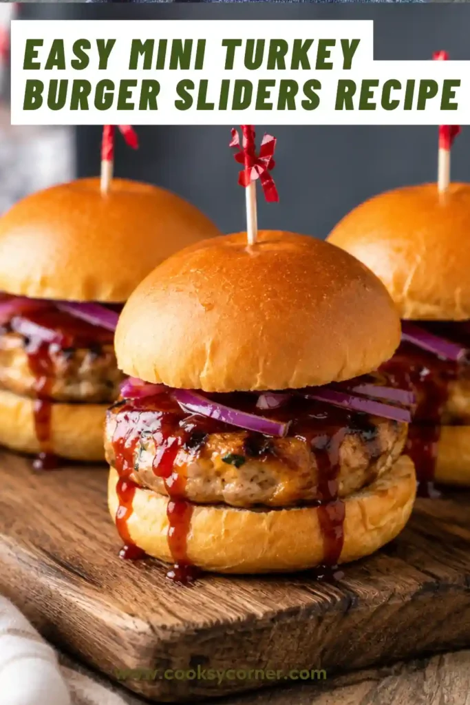 Mini turkey burgers served on slider buns with fresh toppings and melted cheese.