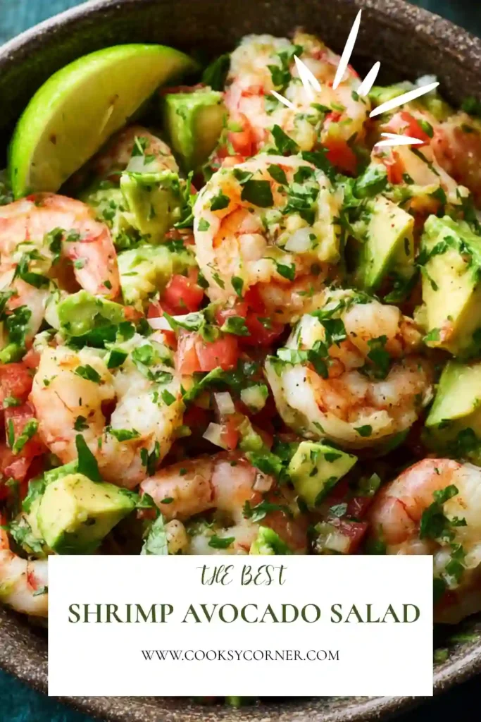 Close-up of a homemade shrimp and avocado salad garnished with cilantro and lime. Fresh ingredients create a bright and flavorful seafood salad.