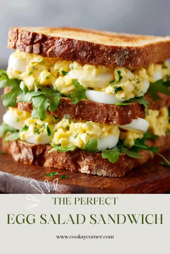 A close-up view of a classic Egg Salad Sandwich Recipe with chopped eggs and Dijon dressing. Served on toasted bread for a satisfying meal.