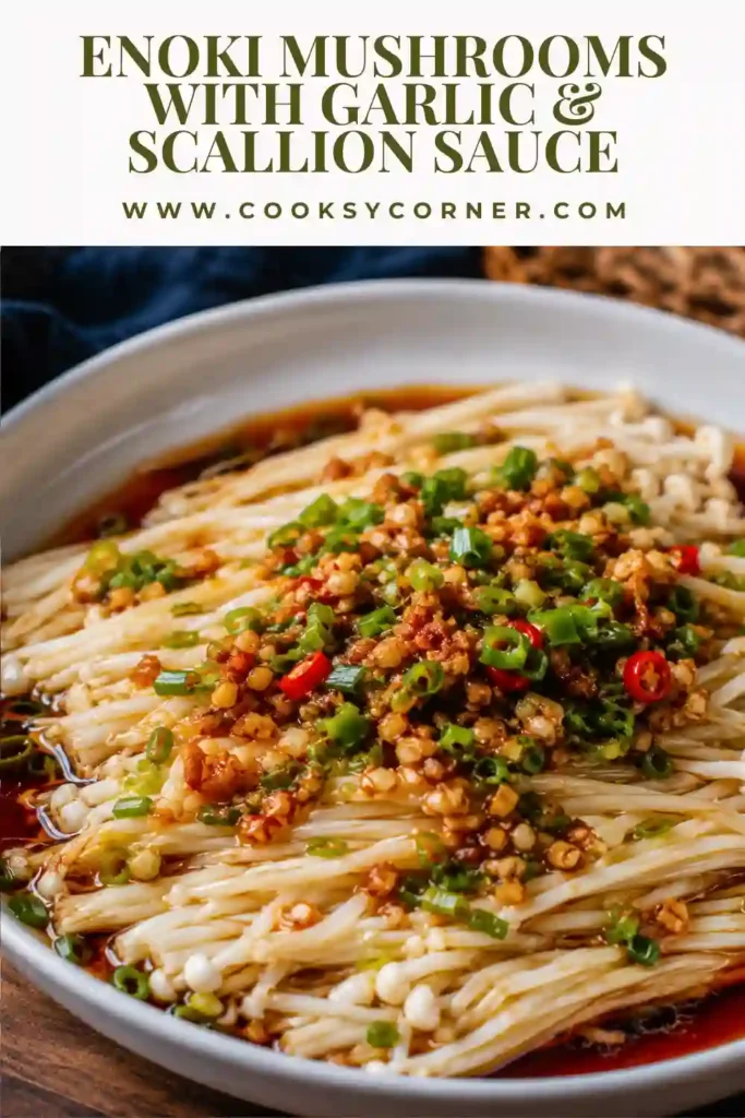 Fresh enoki mushrooms drizzled with savory garlic sauce and garnished with chopped scallions.