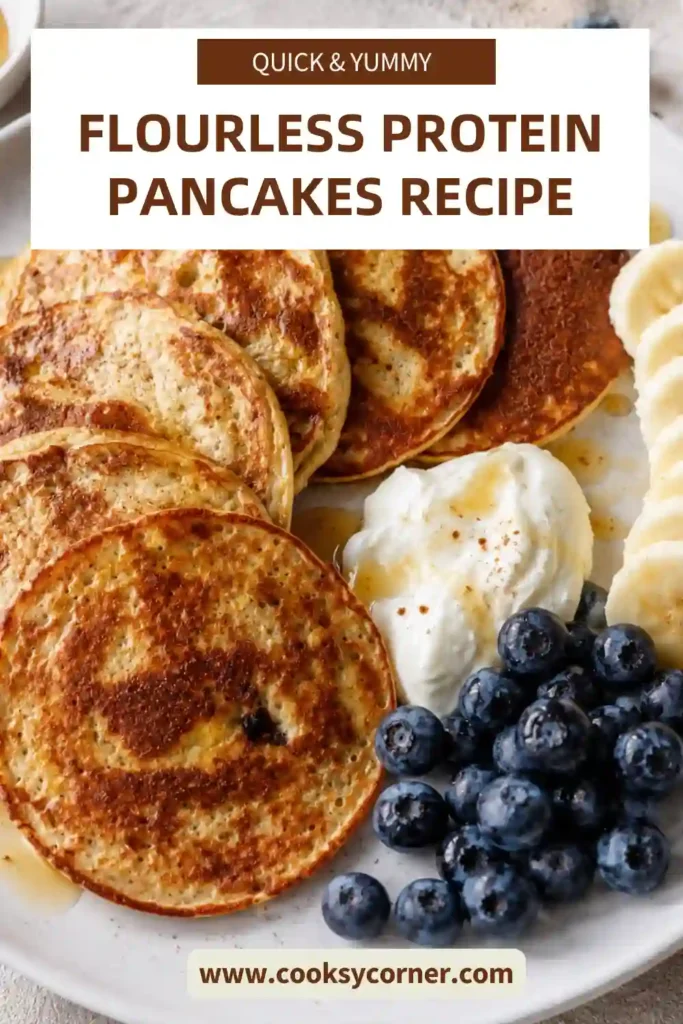 Close-up view of golden protein pancakes cooked in a skillet. The flourless pancakes have a fluffy texture and rich banana flavor.