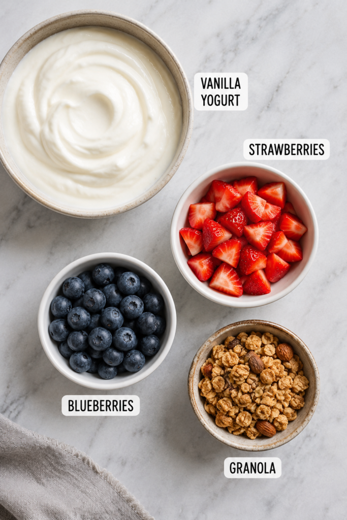 Colorful Frozen Yogurt Bark squares topped with strawberries and blueberries served as a healthy frozen dessert. Simple ingredients and easy preparation make this recipe family-friendly.