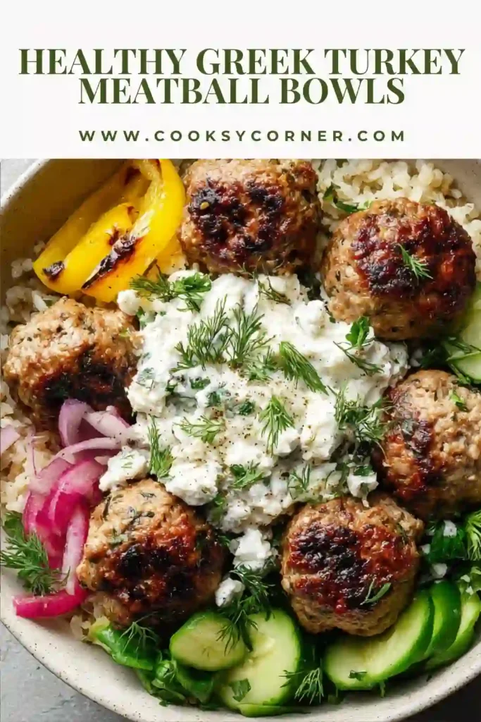 A bowl of Greek Turkey Meatball Bowls topped with juicy turkey meatballs, fresh cucumbers, tomatoes, feta cheese, and creamy tzatziki. This healthy Mediterranean dinner is colorful, protein-rich, and perfect for meal prep.